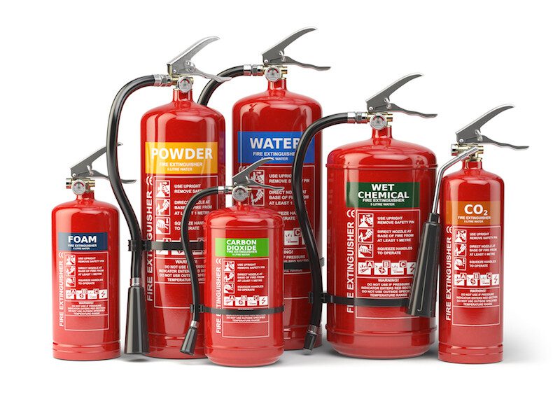 Fire extinguishers isolated on white background. Various types of extinguishers.