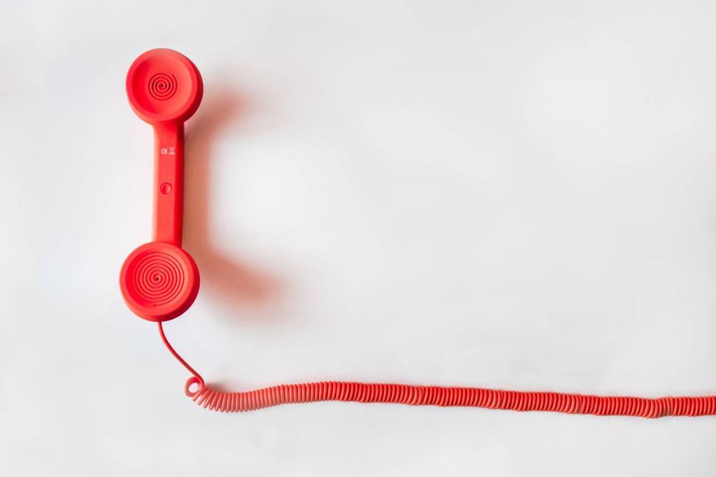 red telephone handle in white background